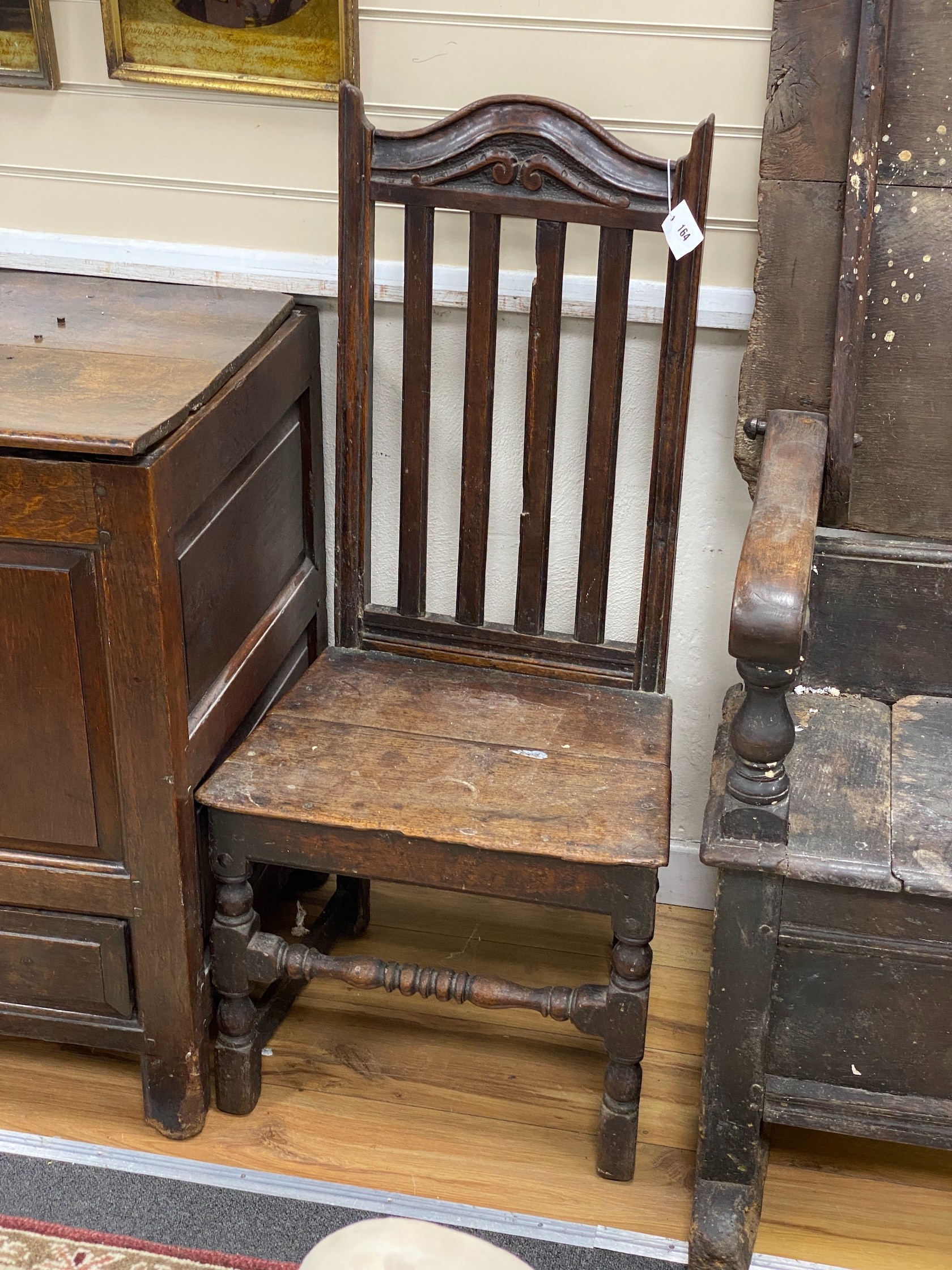 An early 18th century oak Provincial dining chair with slatted back, width 50cm, height 109cm